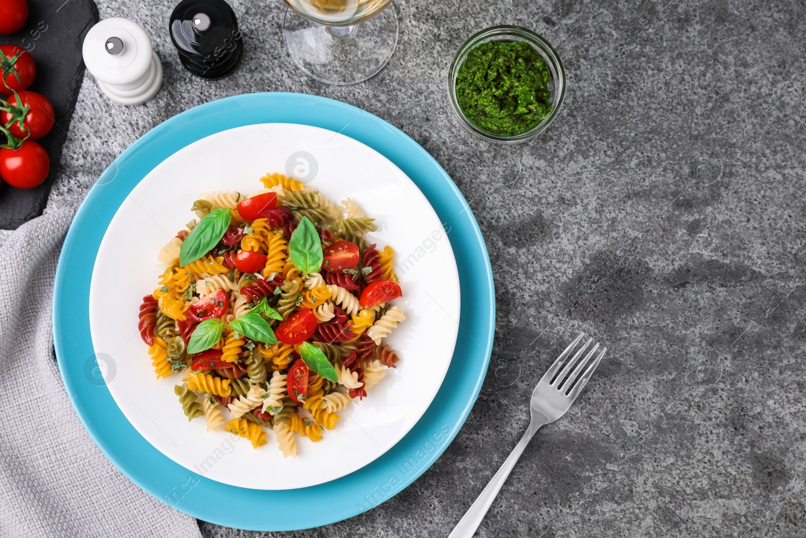 Photo of Flat lay composition with tasty pasta on grey table