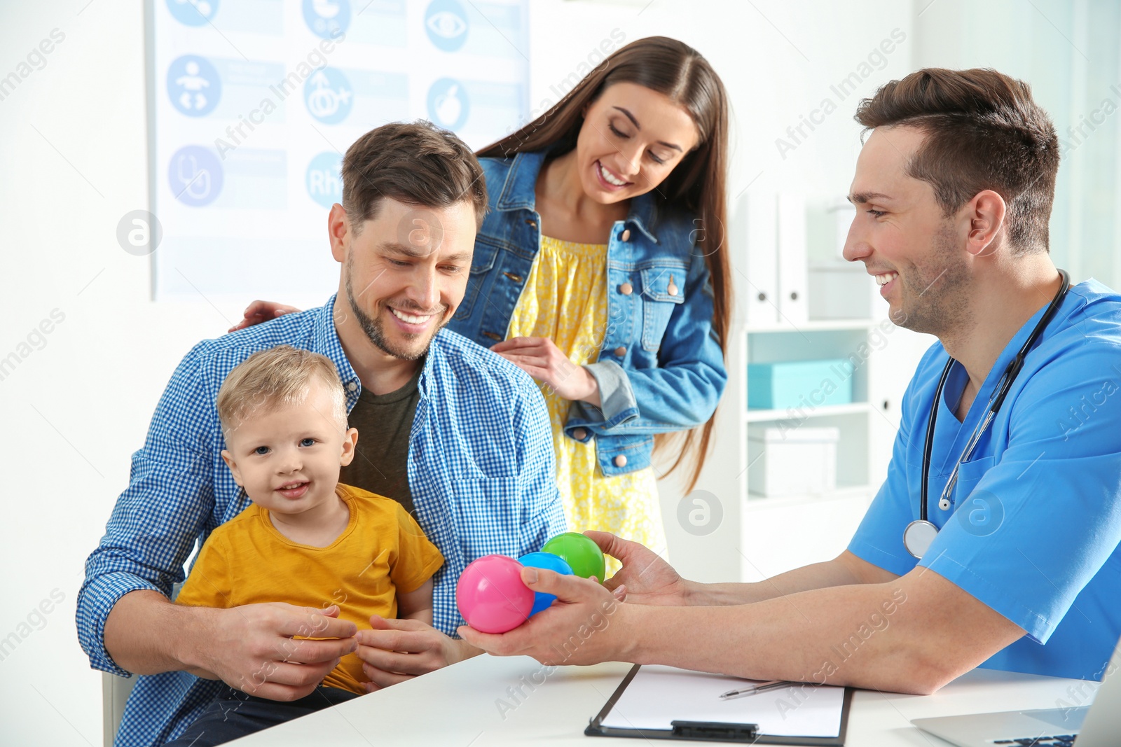 Photo of Family with child visiting doctor in hospital