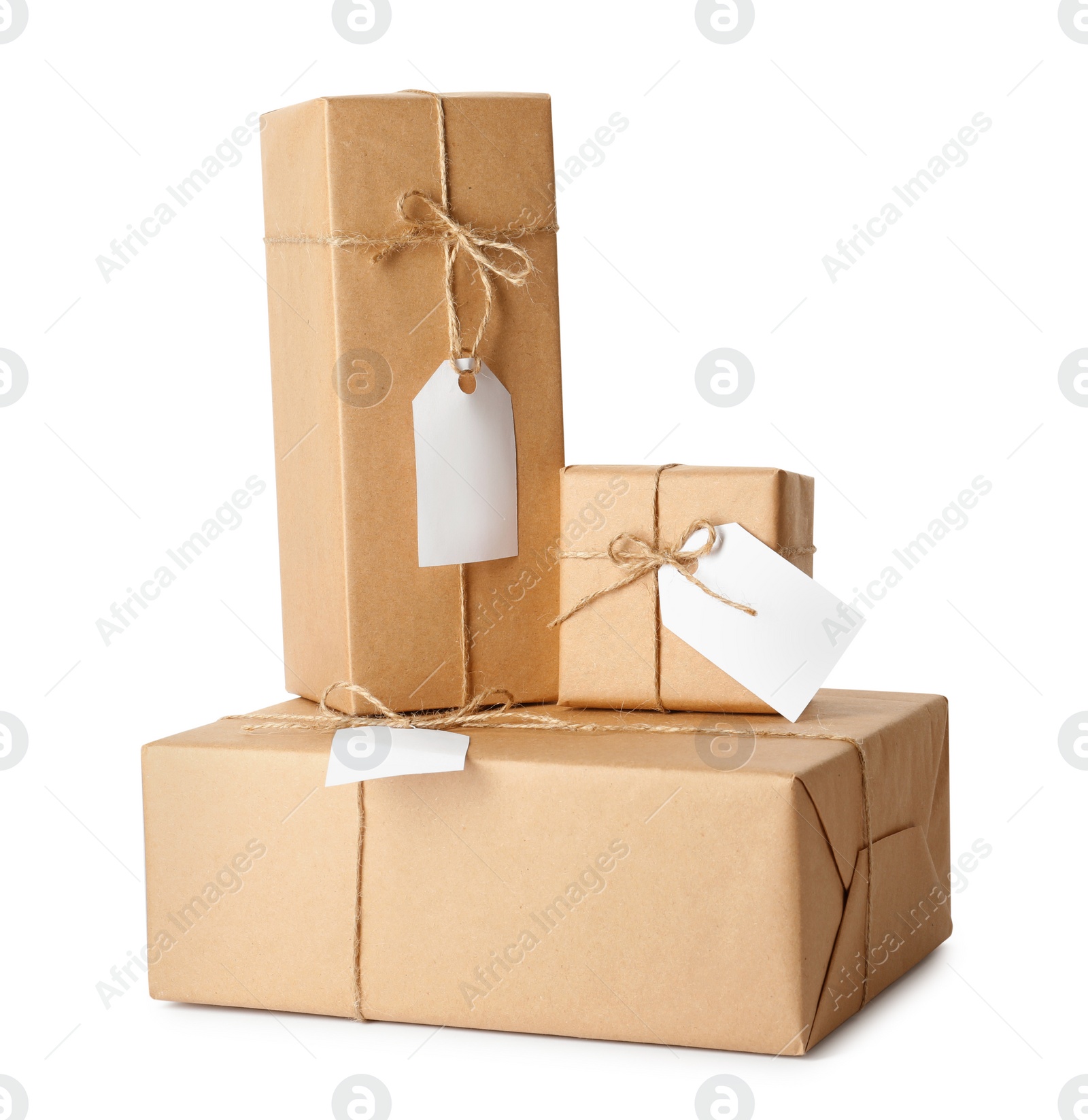 Photo of Gift boxes wrapped in kraft paper with tags on white background