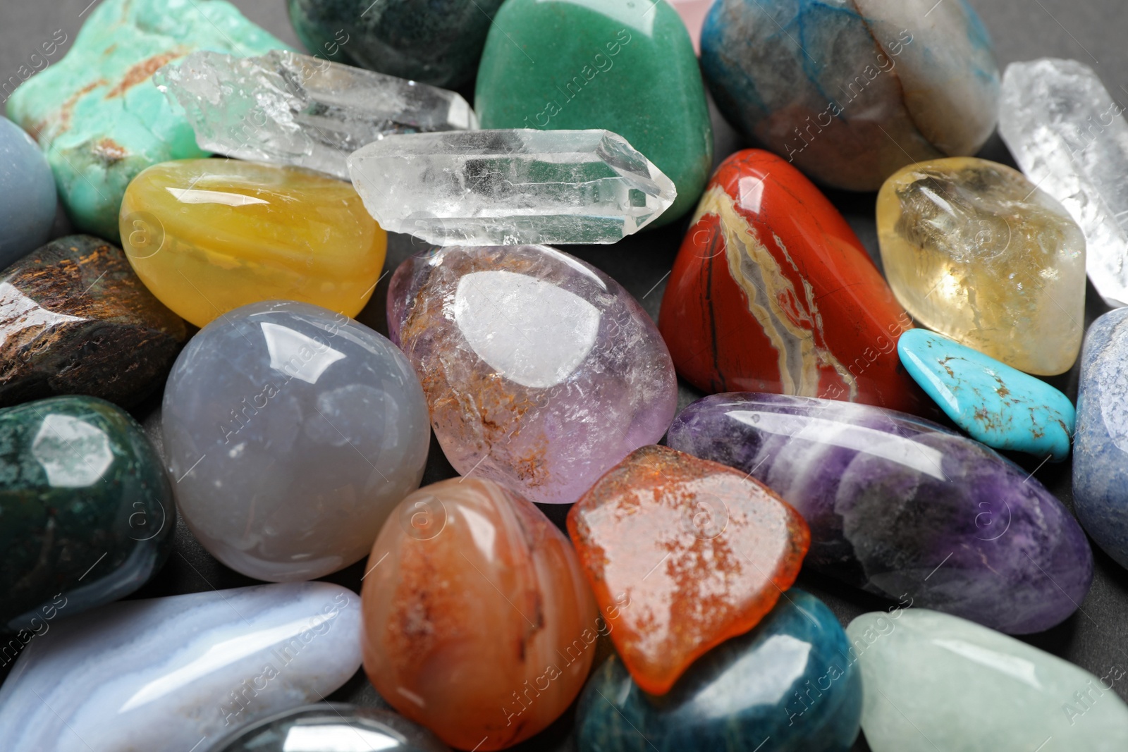 Photo of Different precious gemstones as background, closeup view