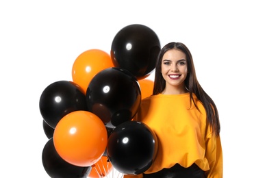 Photo of Beautiful woman with balloons on white background. Halloween party