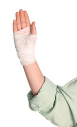 Woman with hand wrapped in medical bandage on white background, closeup