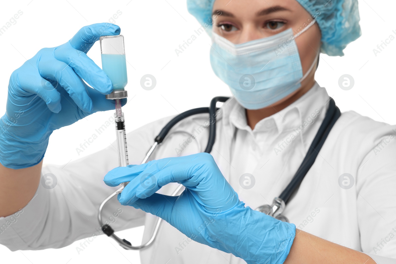 Photo of Doctor filling syringe with medication from glass vial on white background, selective focus