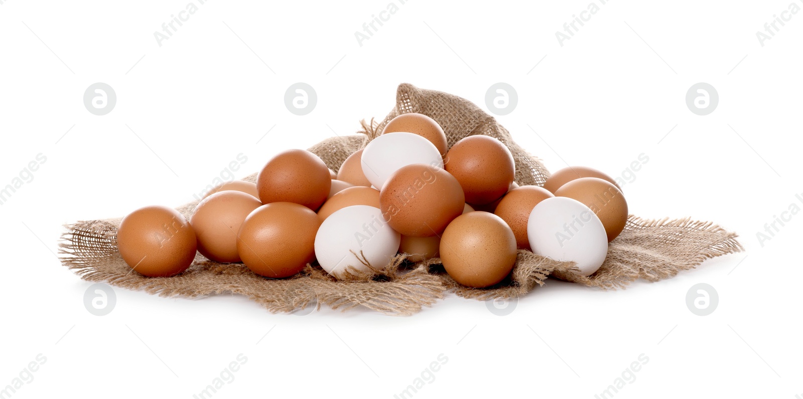 Photo of Fresh chicken eggs and burlap fabric isolated on white