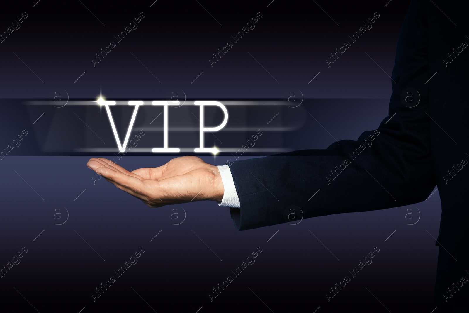 Image of VIP member. Closeup view of man showing virtual abbreviation on dark background