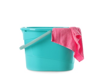Photo of Plastic bucket and rag on white background. Cleaning supplies