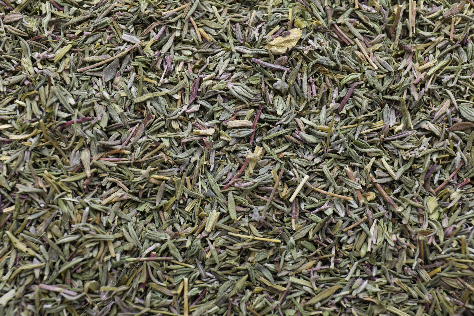 Photo of Top view of dried thyme as background