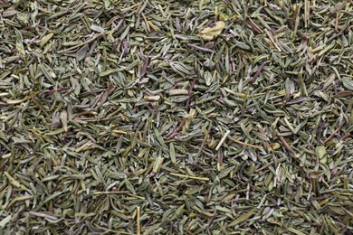 Photo of Top view of dried thyme as background