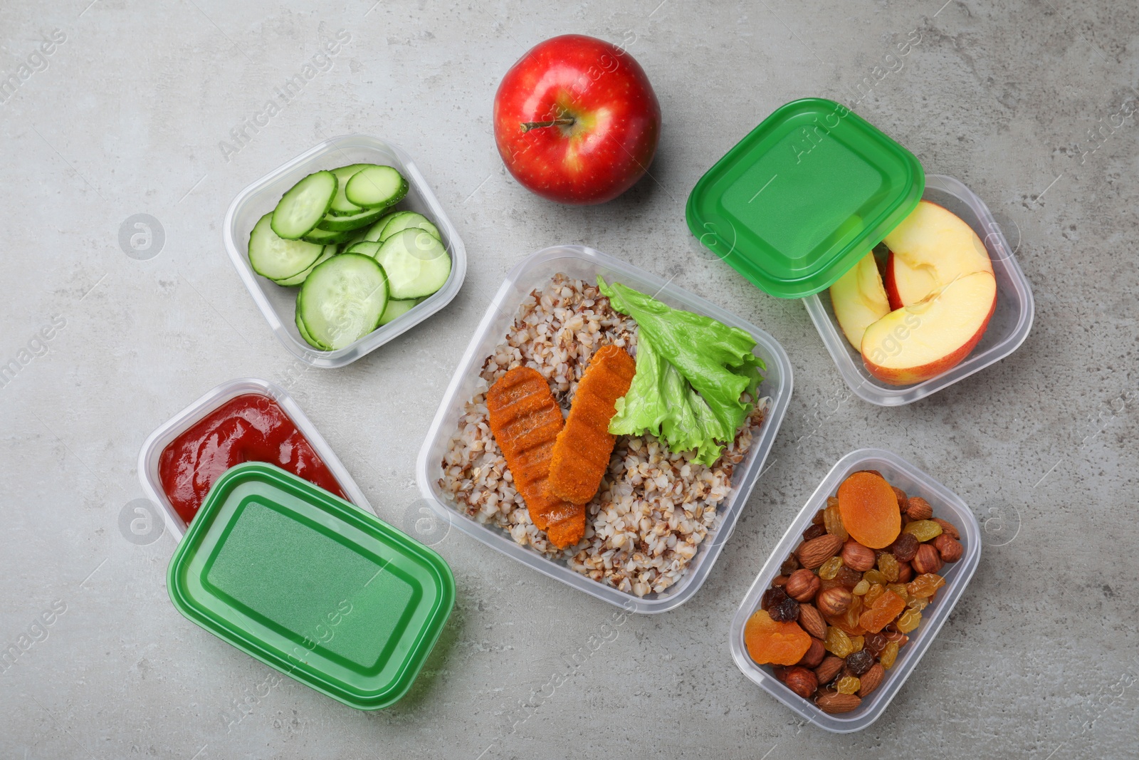 Photo of Set of plastic containers with fresh food on light grey table, flat lay