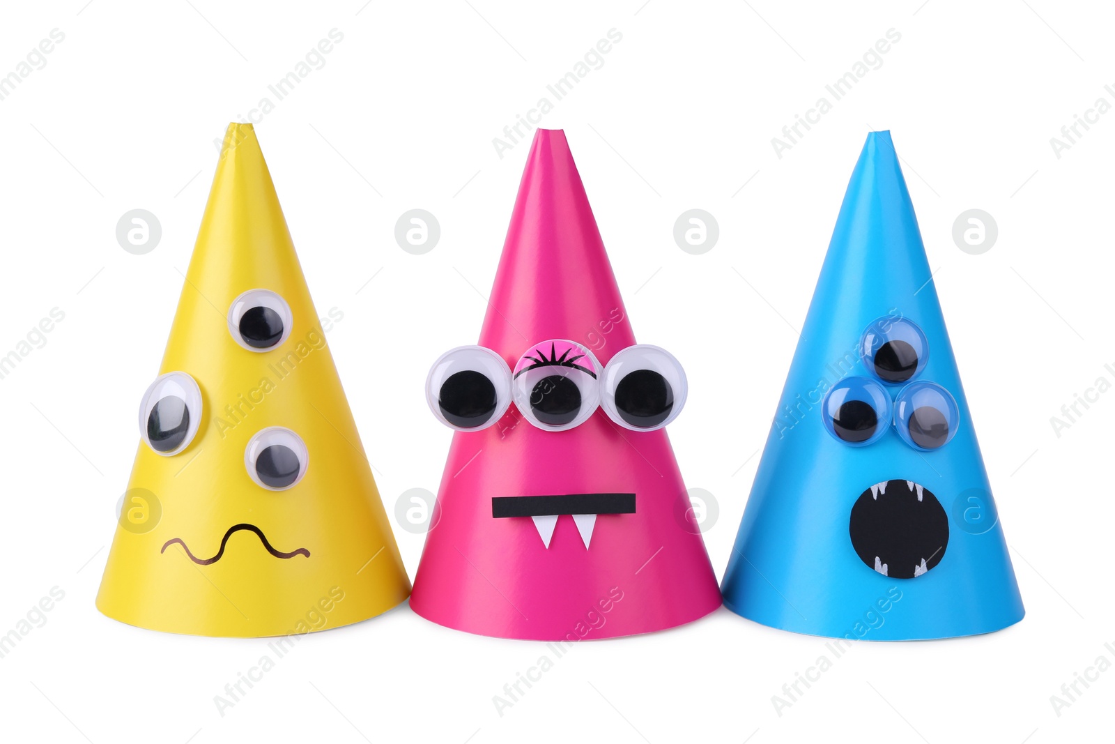 Photo of Funny handmade monsters isolated on white. Halloween decoration