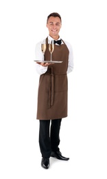 Waiter holding metal tray with glasses of champagne on white background