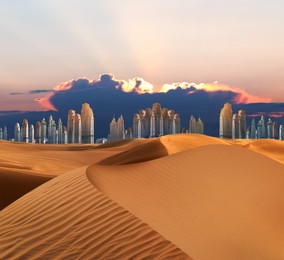 Image of Sandy desert and silhouette of city on horizon at sunset