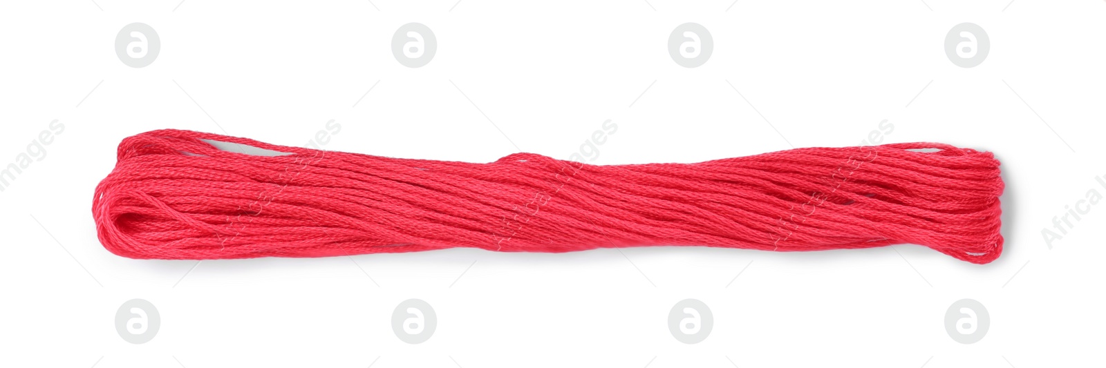 Photo of Light crimson embroidery thread on white background