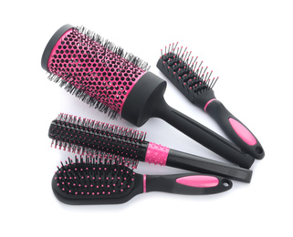 Photo of Set of modern hair brushes on white background, above view