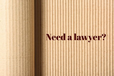Text NEED A LAWYER? on corrugated cardboard 