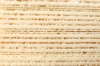 Photo of Closeup view of tasty wafer sticks as background. Sweet food