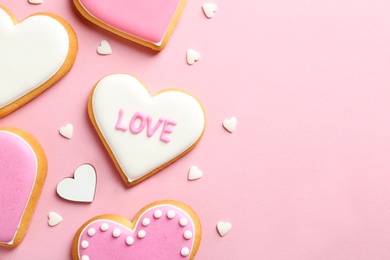 Photo of Composition with decorated heart shaped cookies and space for text on color background, top view. Valentine's day treat