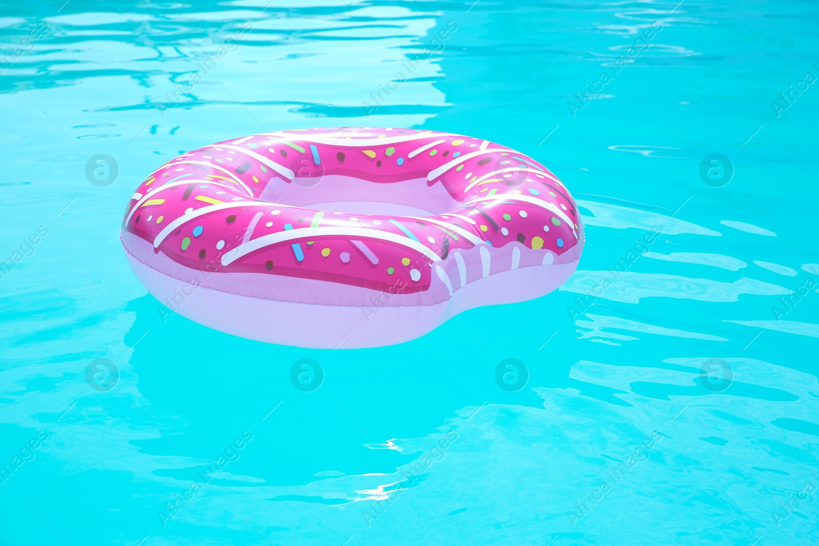 Photo of Inflatable ring in swimming pool on sunny day