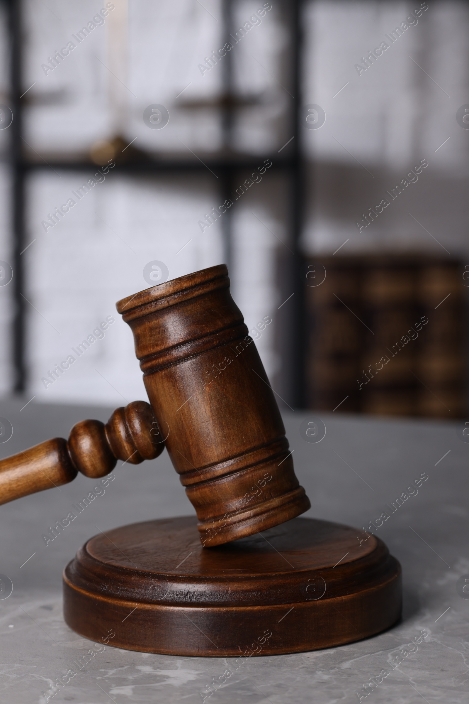 Photo of Law concept. Judge's gavel on light grey marble table indoors, closeup