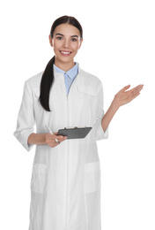Photo of Happy young woman in lab coat with clipboard on white background