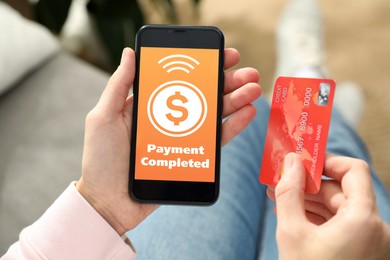 Image of Woman successfully made payment using online banking application on smartphone indoors, closeup