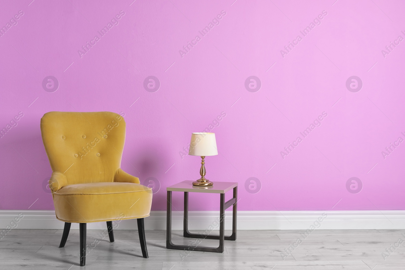 Photo of Comfortable armchair in stylish living room interior with space for text