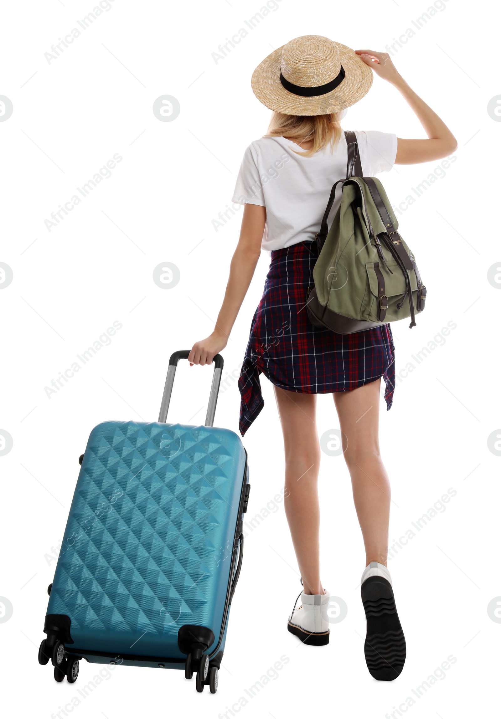 Photo of Woman with suitcase walking on white background, back view. Summer travel