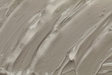 Photo of Clear cosmetic gel on grey background, top view