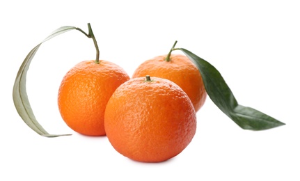 Photo of Whole fresh tangerines with green leaves on white background