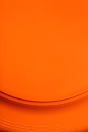 Photo of Orange textured surface as background, closeup view