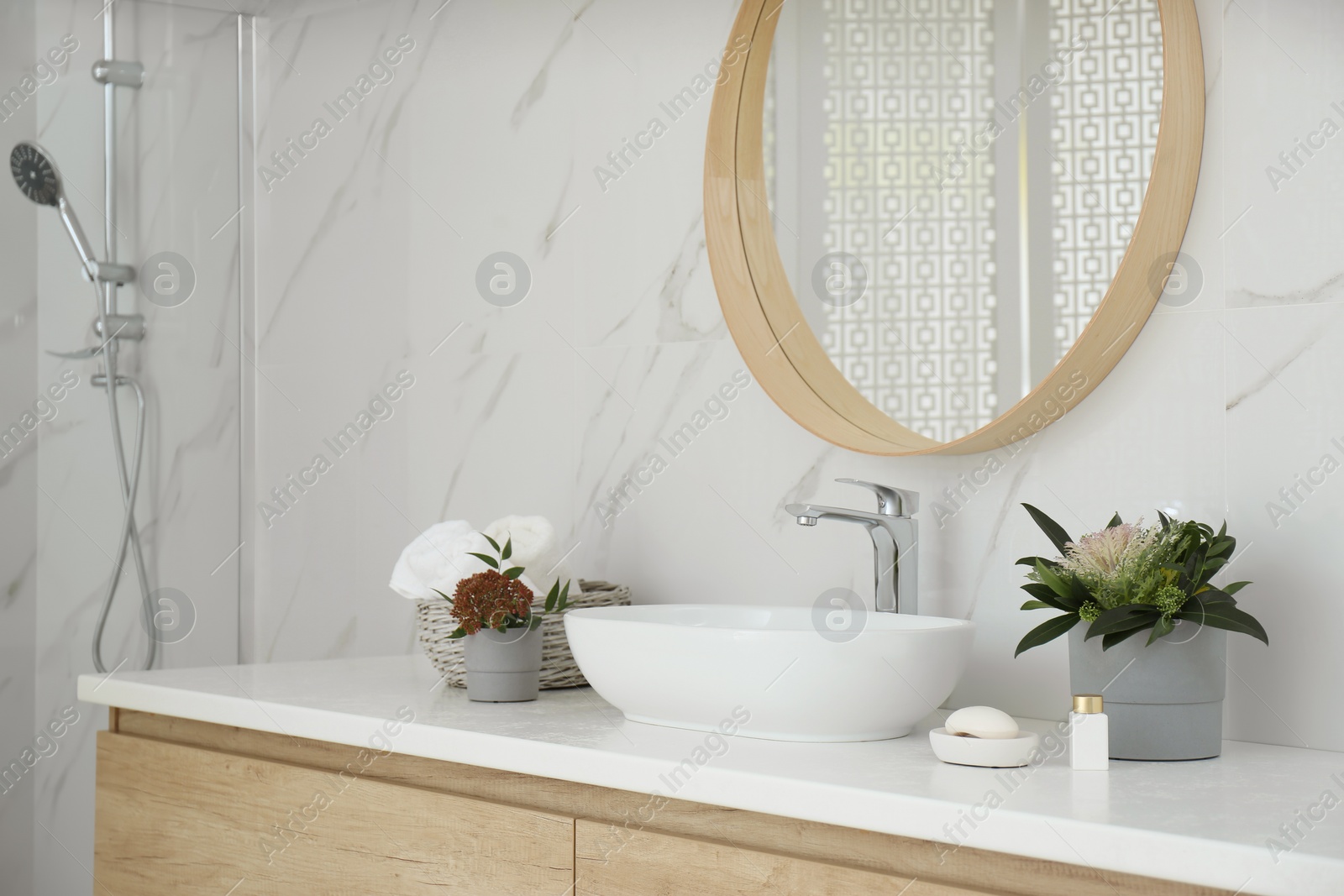 Photo of Modern bathroom interior with stylish mirror and vessel sink