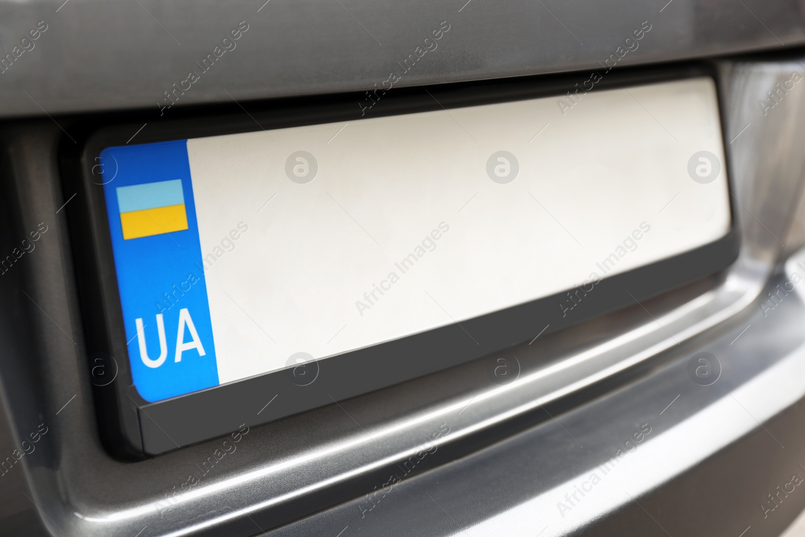 Photo of Car with vehicle registration plate, closeup view