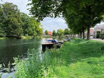 Photo of Beautiful view of canal with moored boats on sunny day