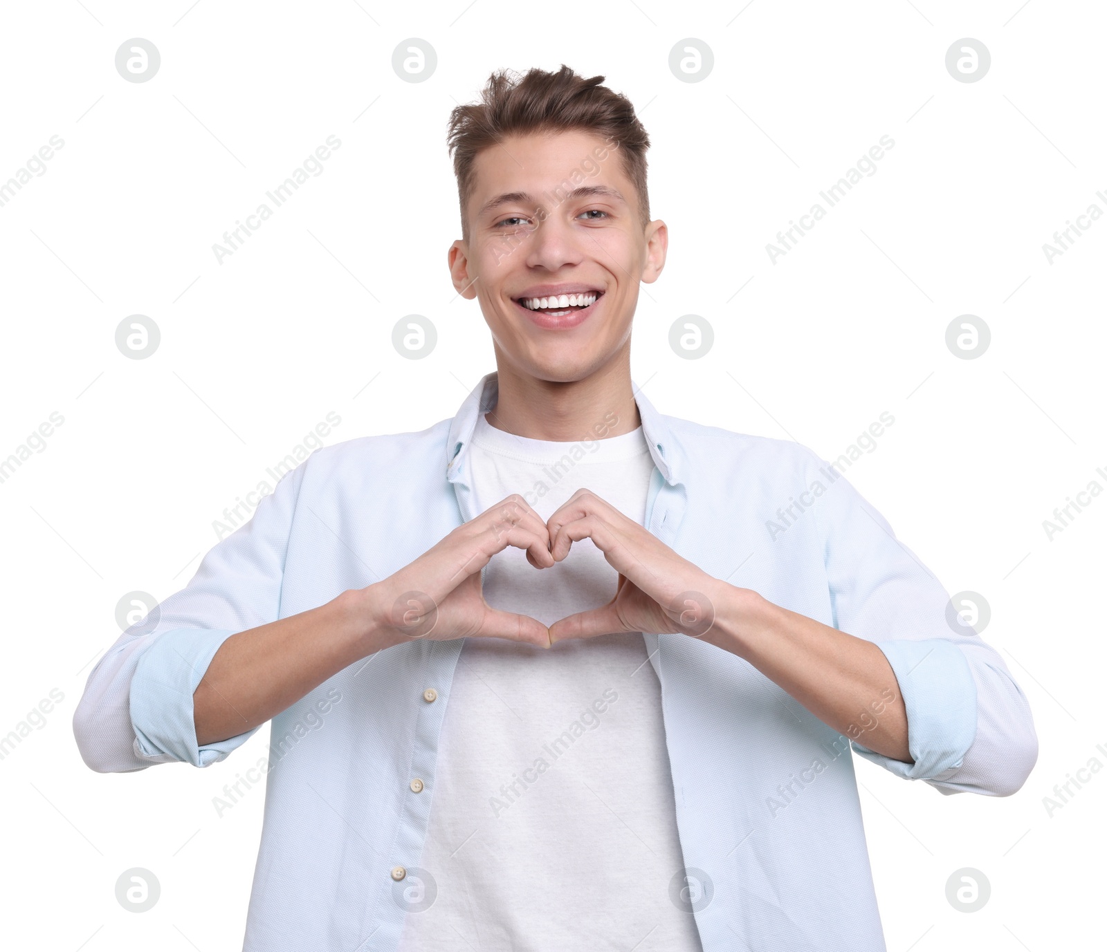 Photo of Happy man showing heart gesture with hands on white background