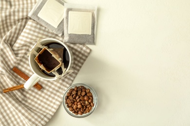 Photo of Flat lay composition with drip coffee on white table. Space for text