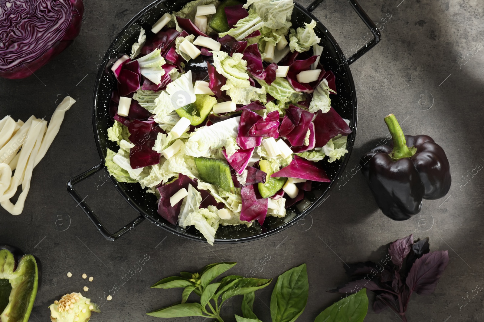 Photo of Delicious salad with Chinese cabbage, suluguni cheese and bell pepper on grey table, flat lay