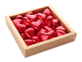 Photo of Heart shaped chocolate candies in box on white background