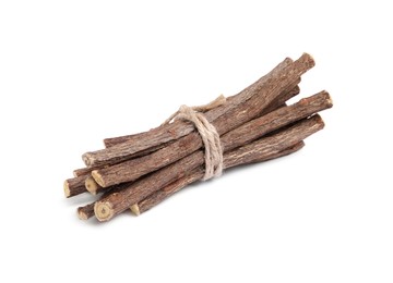 Dried sticks of liquorice root on white background