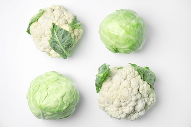 Photo of Flat lay composition with ripe cabbages on white background