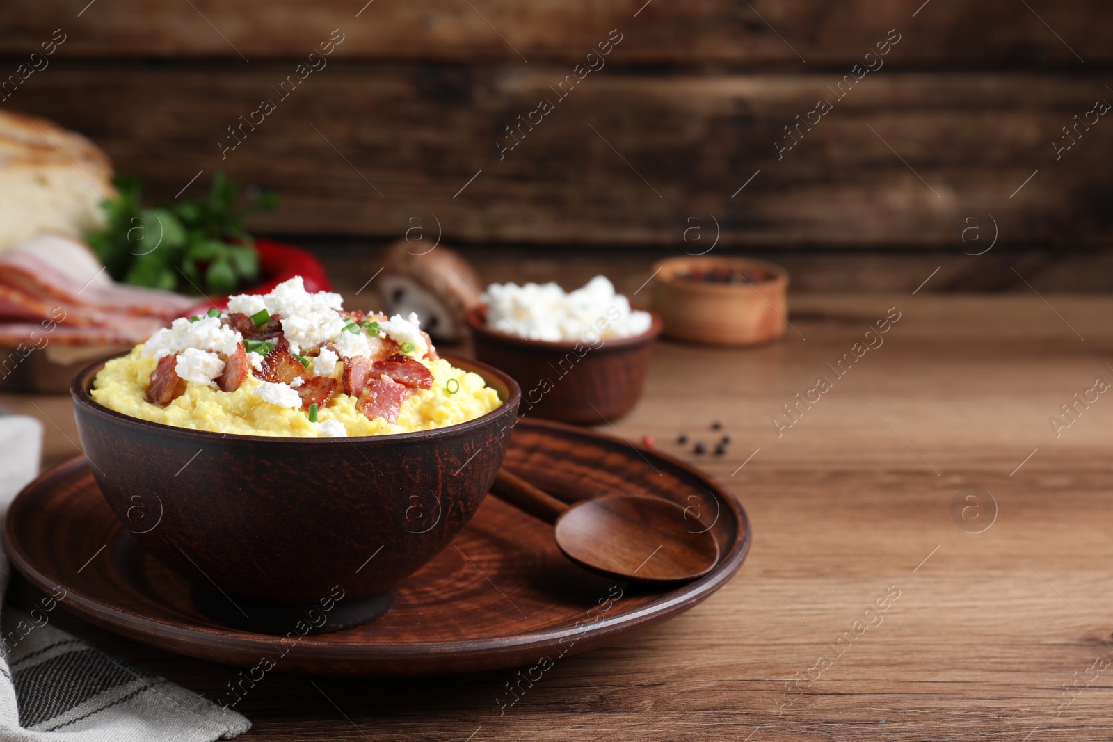 Photo of Delicious traditional banosh served on wooden table