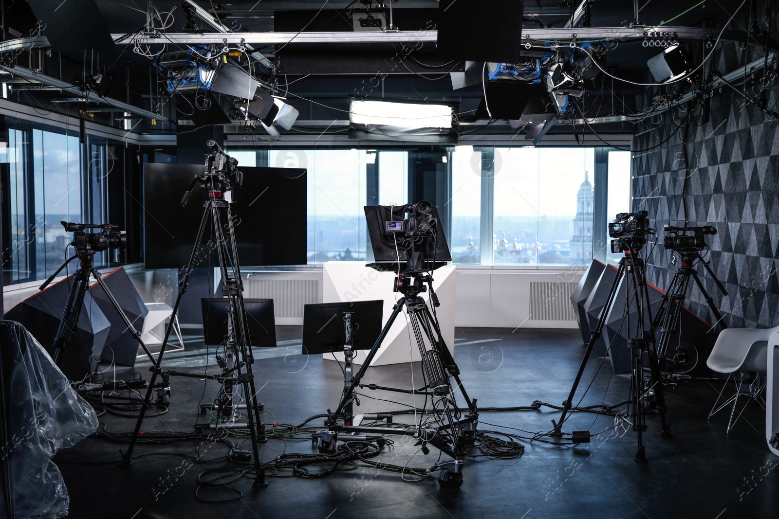 Photo of Modern video recording studio with professional cameras