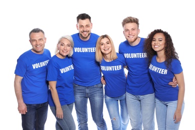 Team of volunteers in uniform on white background