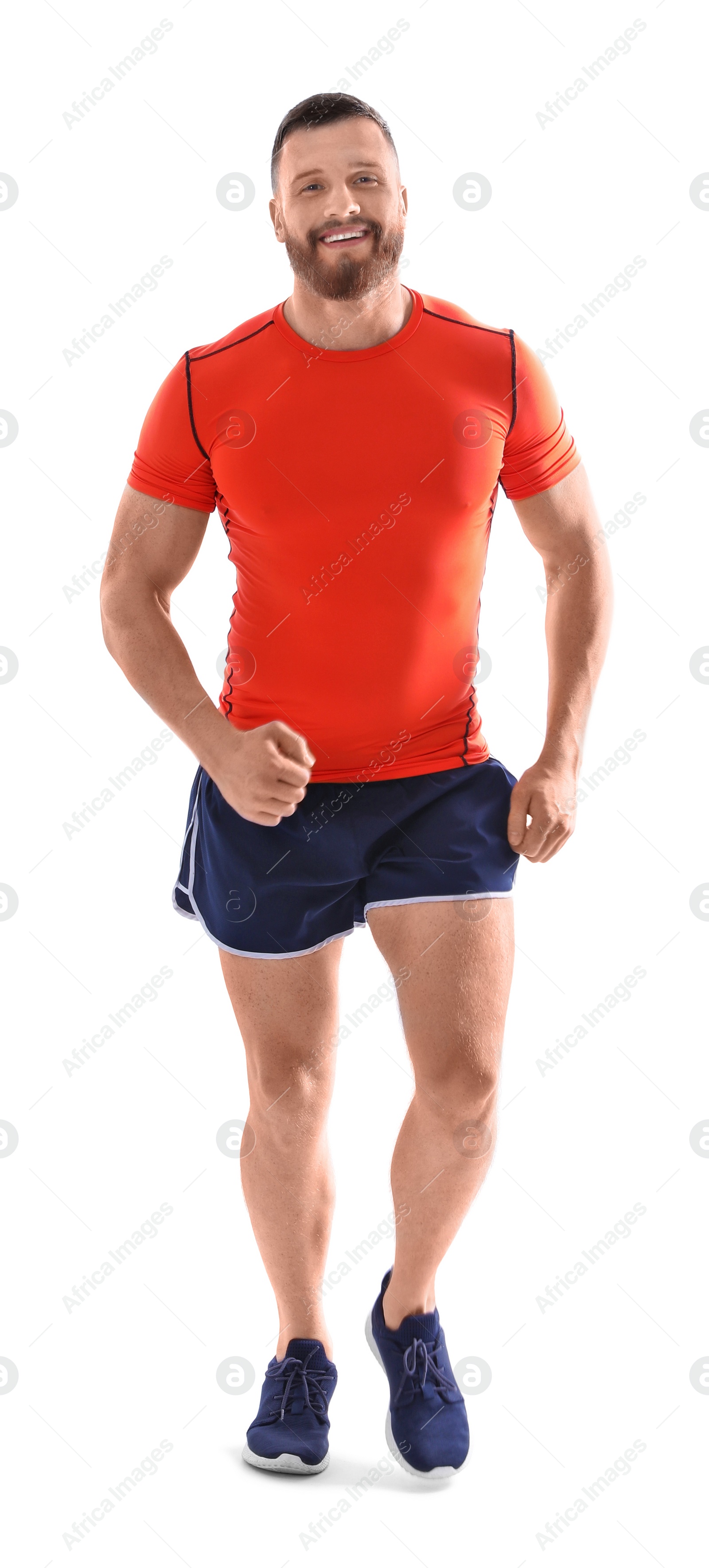 Photo of Young man in sportswear running on white background