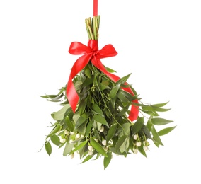 Photo of Mistletoe bunch with red bow isolated on white. Traditional Christmas decor