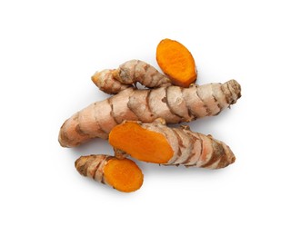 Photo of Fresh turmeric roots isolated on white, top view