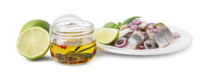 Photo of Tasty fish marinade in jar, herring and lime isolated on white