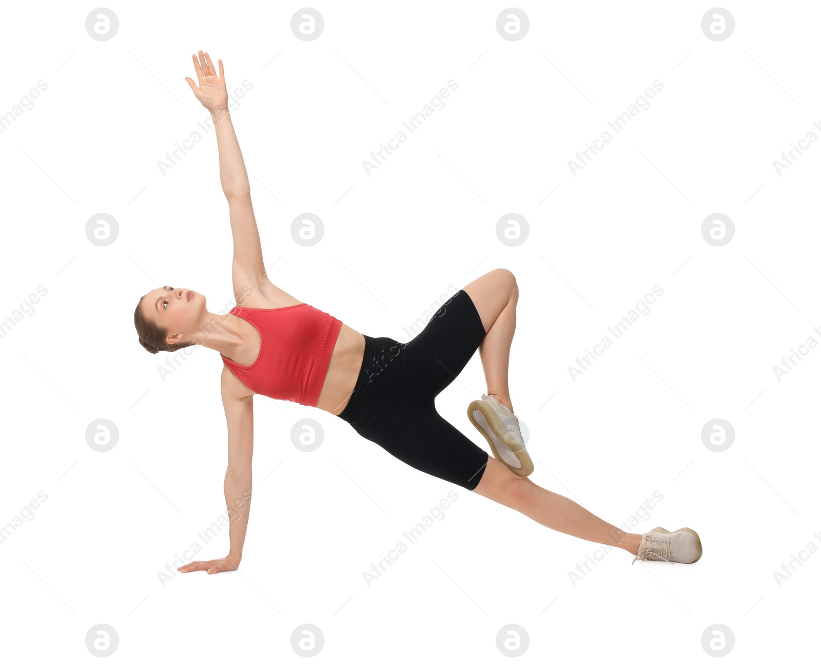 Photo of Young woman practicing yoga on white background