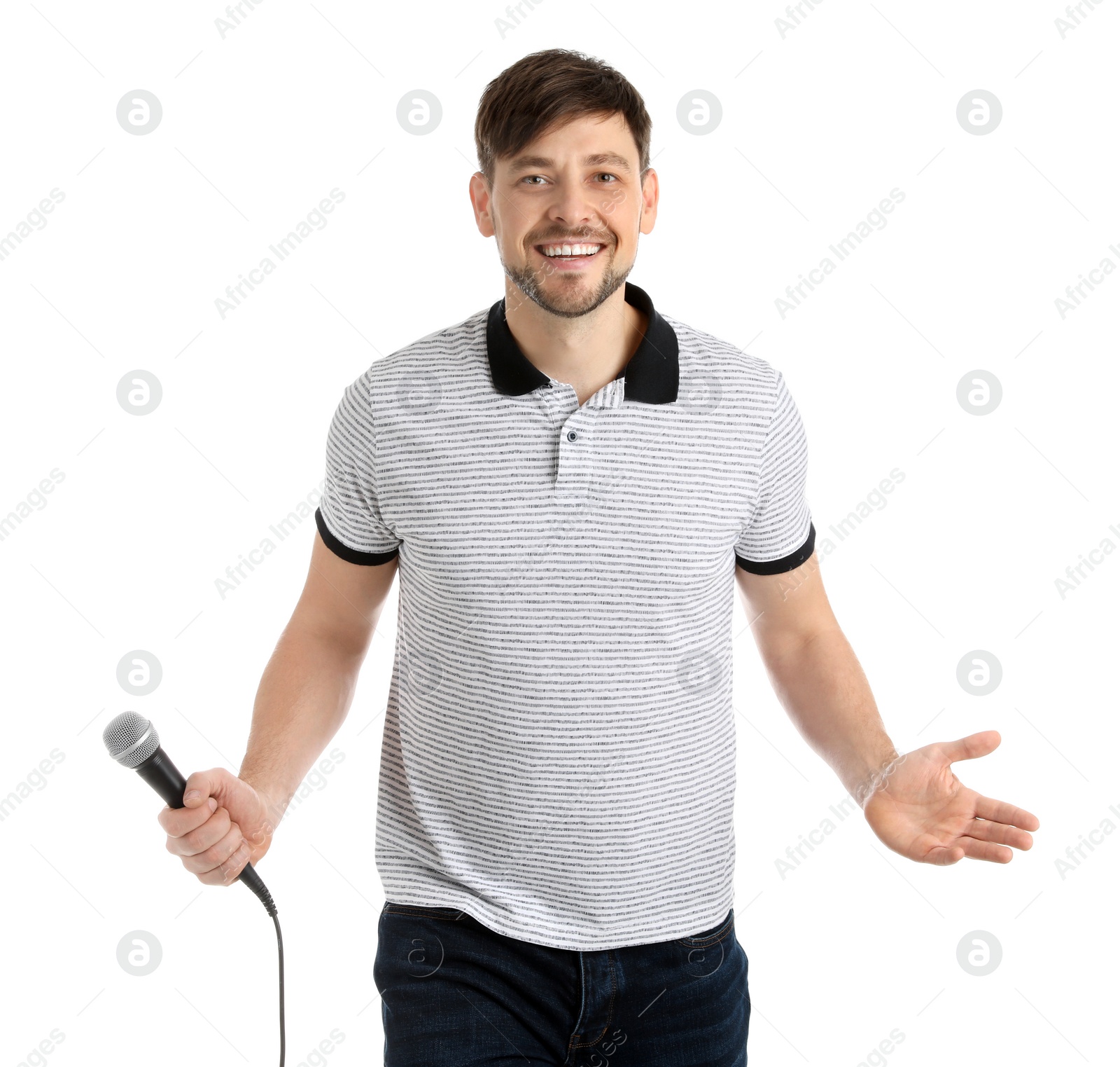 Photo of Handsome man in casual clothes posing with microphone on white background