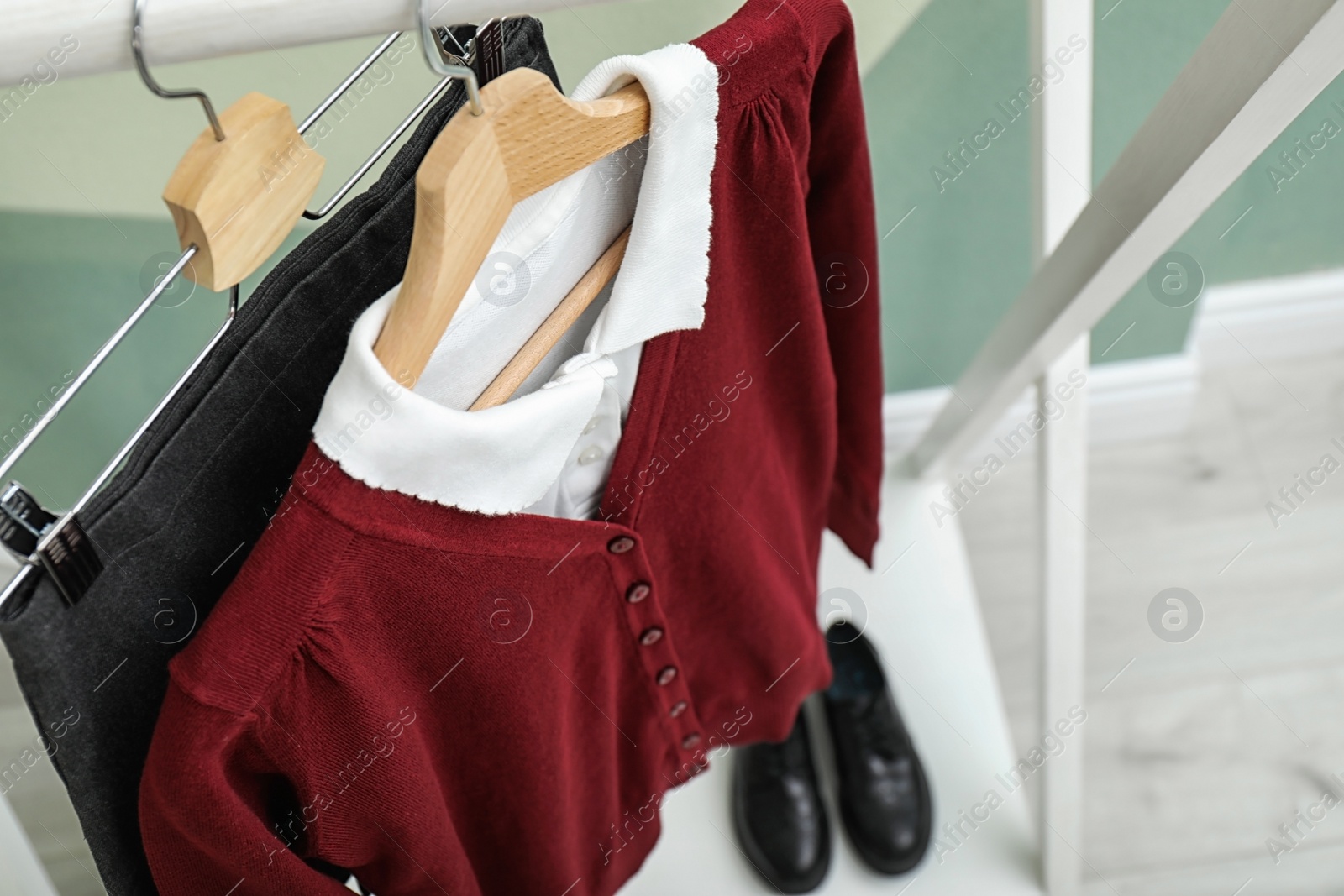 Photo of School uniform for girl on hangers, closeup