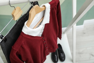 Photo of School uniform for girl on hangers, closeup